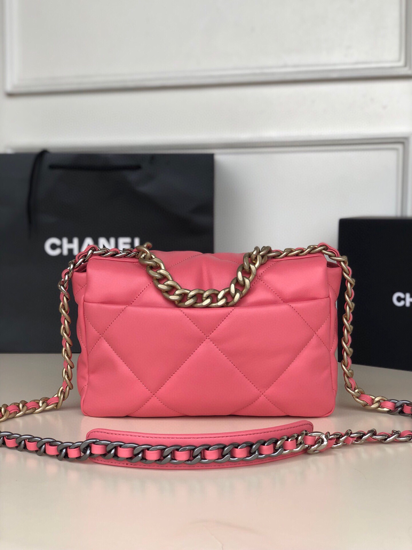 Ch*el 19 handbag shiny leather, gold-tone, silver-tone & ruthenium-finish metal pink 6.2 × 10.1 × 3.5 in