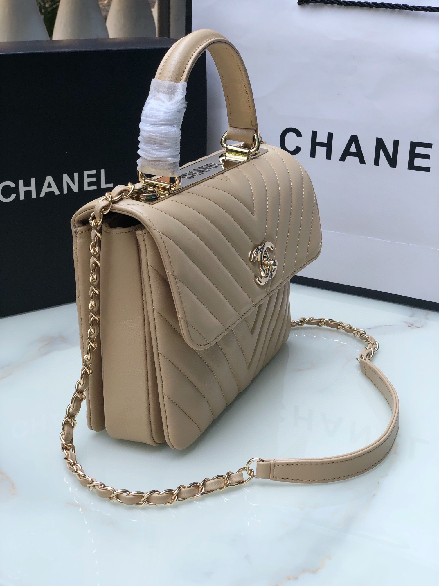 Ch*el flap bag with top handle beige 6.6 × 9.8 × 4.7 in